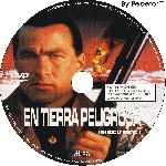 carátula cd de En Tierra Peligrosa