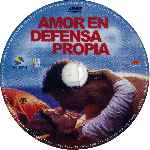 carátula cd de Amor En Defensa Propia